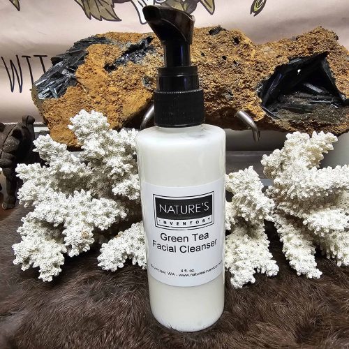 Green Tea Facial Cleanser in a white bottle