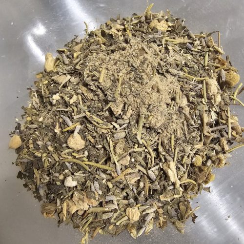 Recharge and Migraine Away Tea a pile of green and brown leaves
