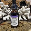 Headache Blend Tincture in a small glass bottle