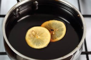 Immune-Boosting Recipes Molasses And Lemon Mixture In A Black Pan