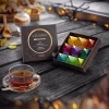 Organic Herbal Tea Pyramid Gift Set With nine different types of tea boxes on the table photo