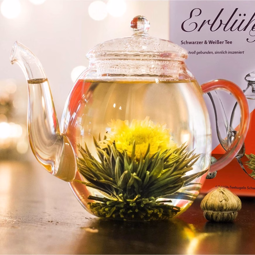 Blooming Tea Set With Glass Jug White &Amp; Black Tea Blooming Tea Set With Glass Jug White &Amp; Black Tea In The Teapot Photo